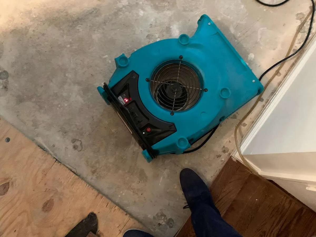 Air mover drying subfloor during Leak Detection & Repair in Cerritos
